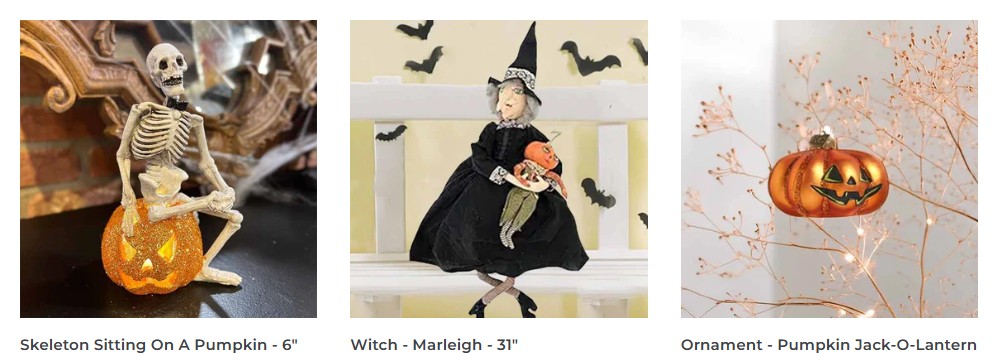Three Halloween decorations: a skeleton sitting on a glittery pumpkin, a witch doll in black holding a pumpkin, and a glowing pumpkin jack-o’-lantern ornament hanging from a branch.